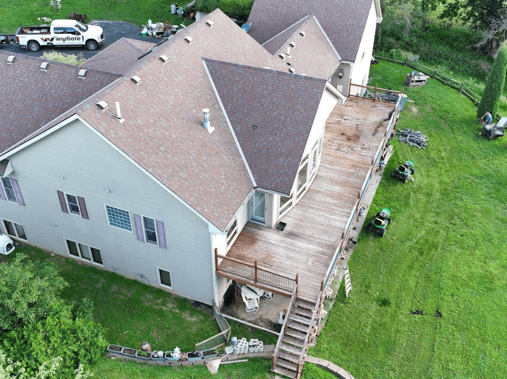 Aerial view of worn-out, expansive wooden deck that needs to be replaced