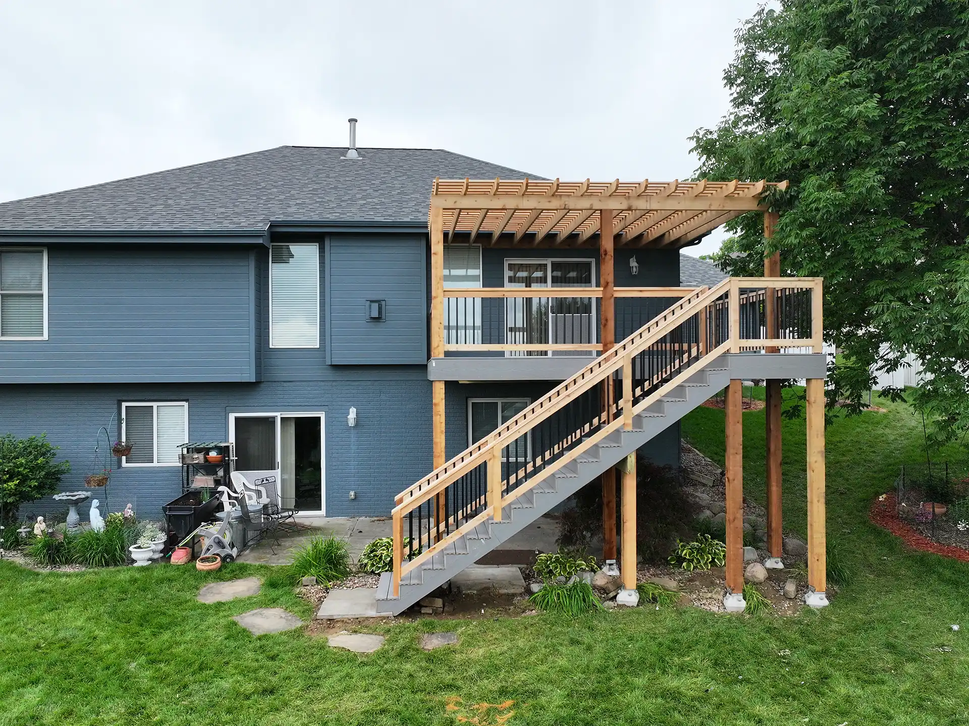 Photo of an elevated custom deck with patio underneath