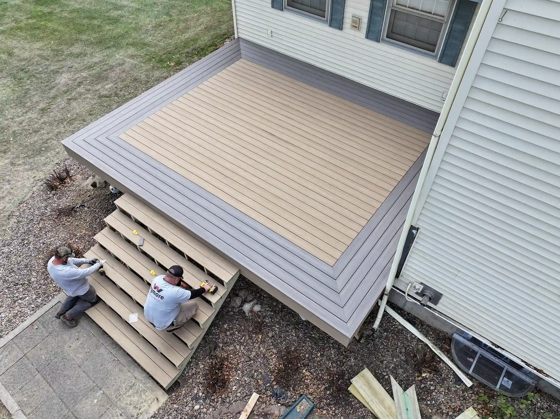 A Wymore Deck & Fence crew building a deck - Deck Building Company in Omaha