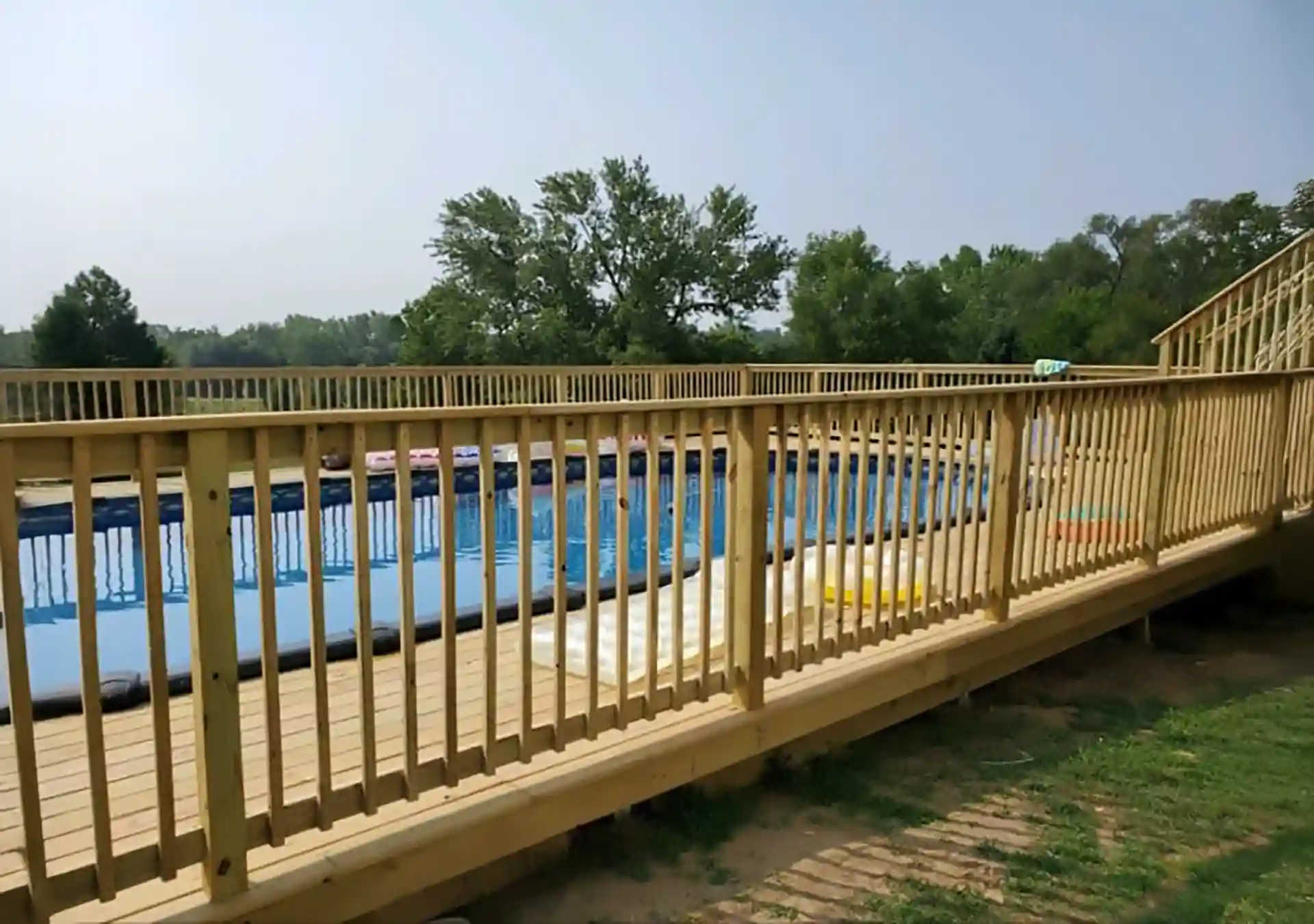 photo of a wooden pool deck railing - Deck Railing Ideas - Composite Railings and Wooden Railings