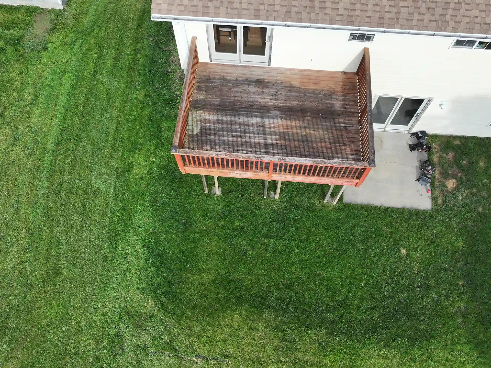 aerial view of balcony deck with worn out wooden boards