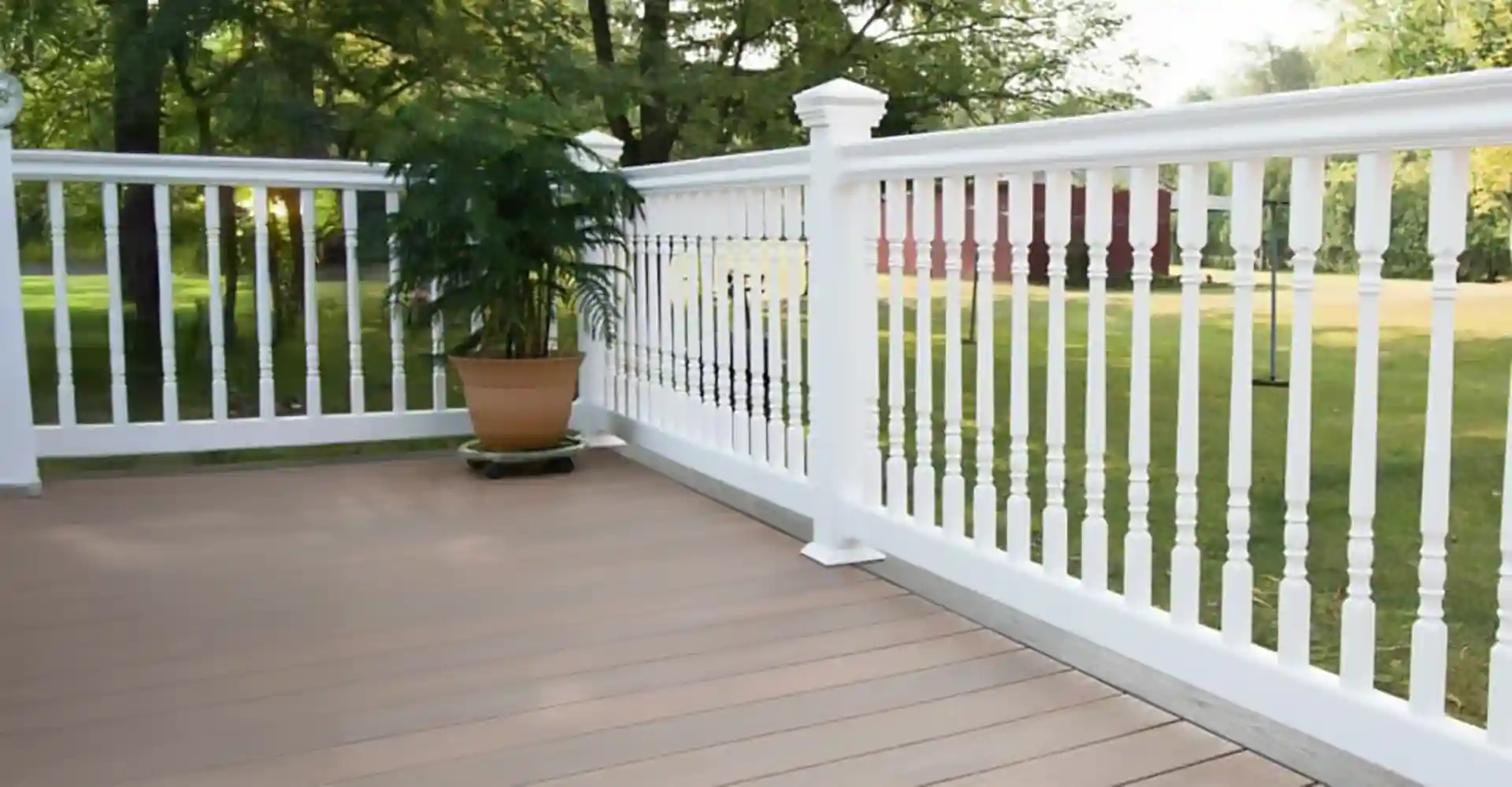 photo of a composite deck with white deck railing - How to choose the right material for my deck railings