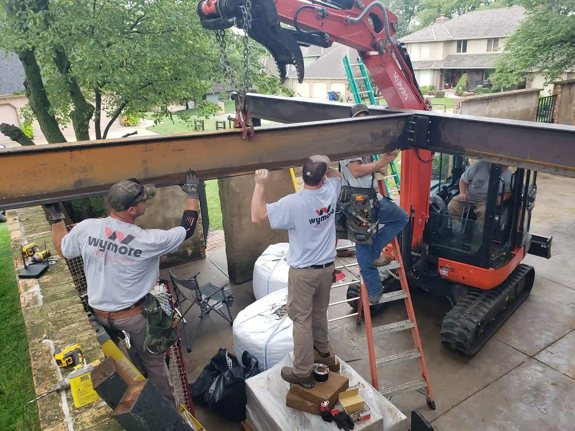 Deck crew working on a steel support beams - Mistakes-to-Avoid-When-Choosing-a-Deck-Builder - Deck Building codes