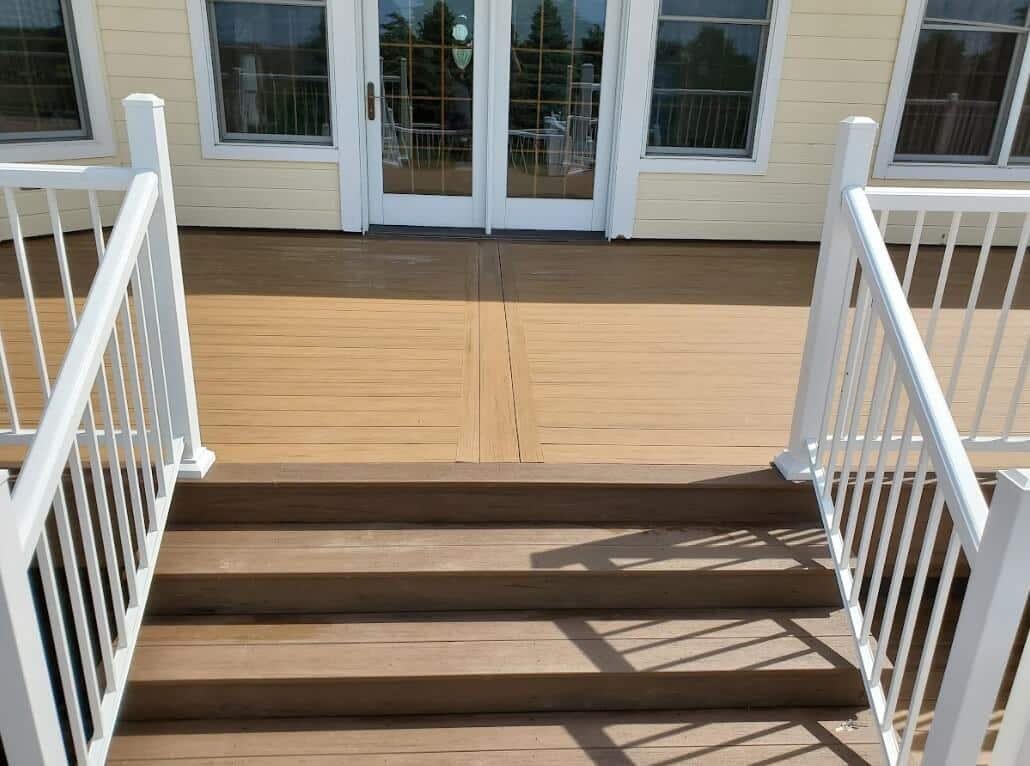 photo of a composite deck with deck railing and deck steps