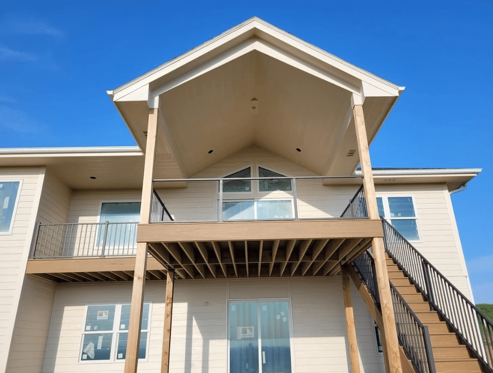 photo-of-an-elevated-covered-deck-with-deck-railing-glass-panels-and-steps - Glass Railings in elevated composite deck