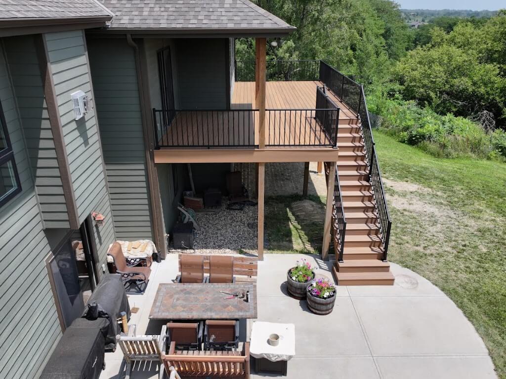 photo of an elevated deck with a patio below